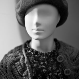 grayscale photo of woman wearing knit cap and knit shirt