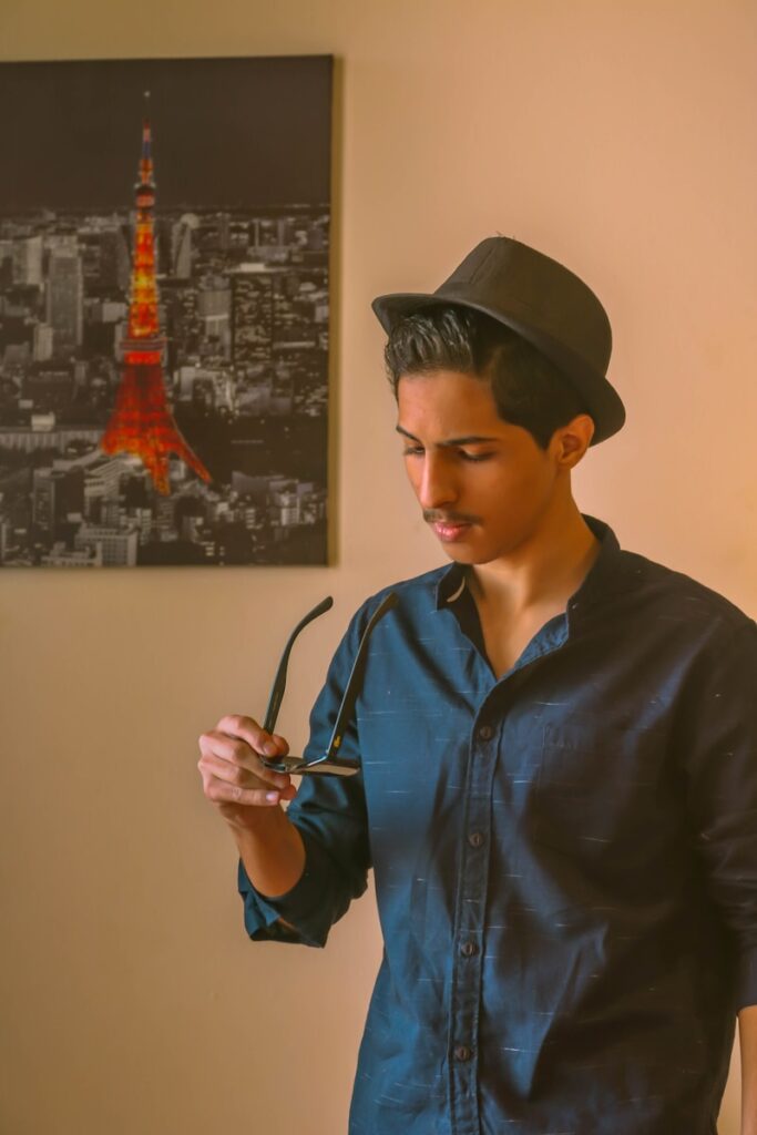 man in black button up shirt wearing black hat
